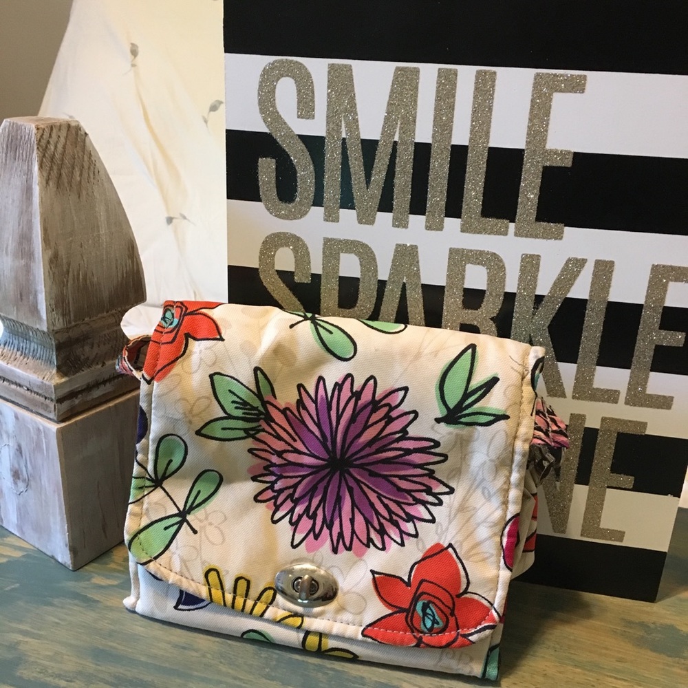 Cosmetic travel-bag with strap.